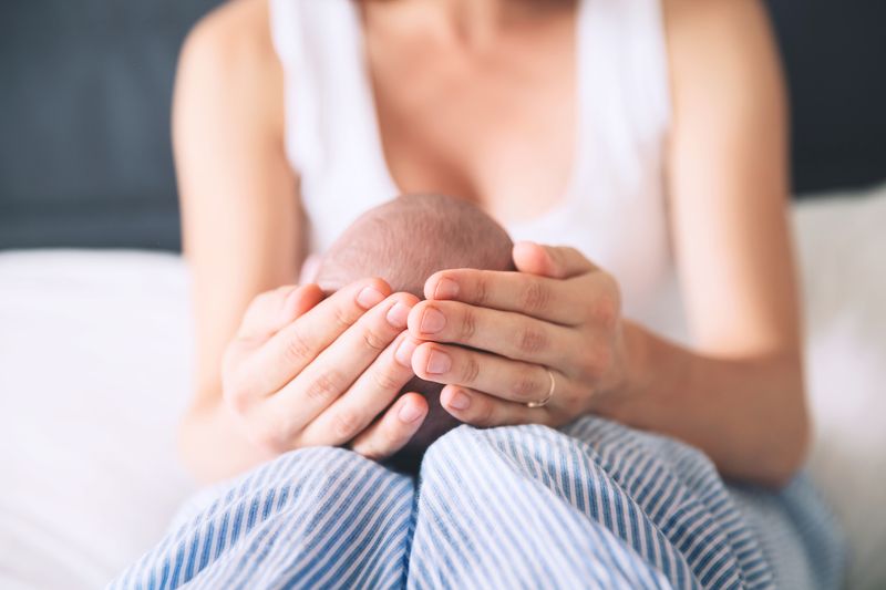 mom holding baby