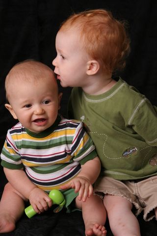 tandem nursing, brothers, boy kissing his brother