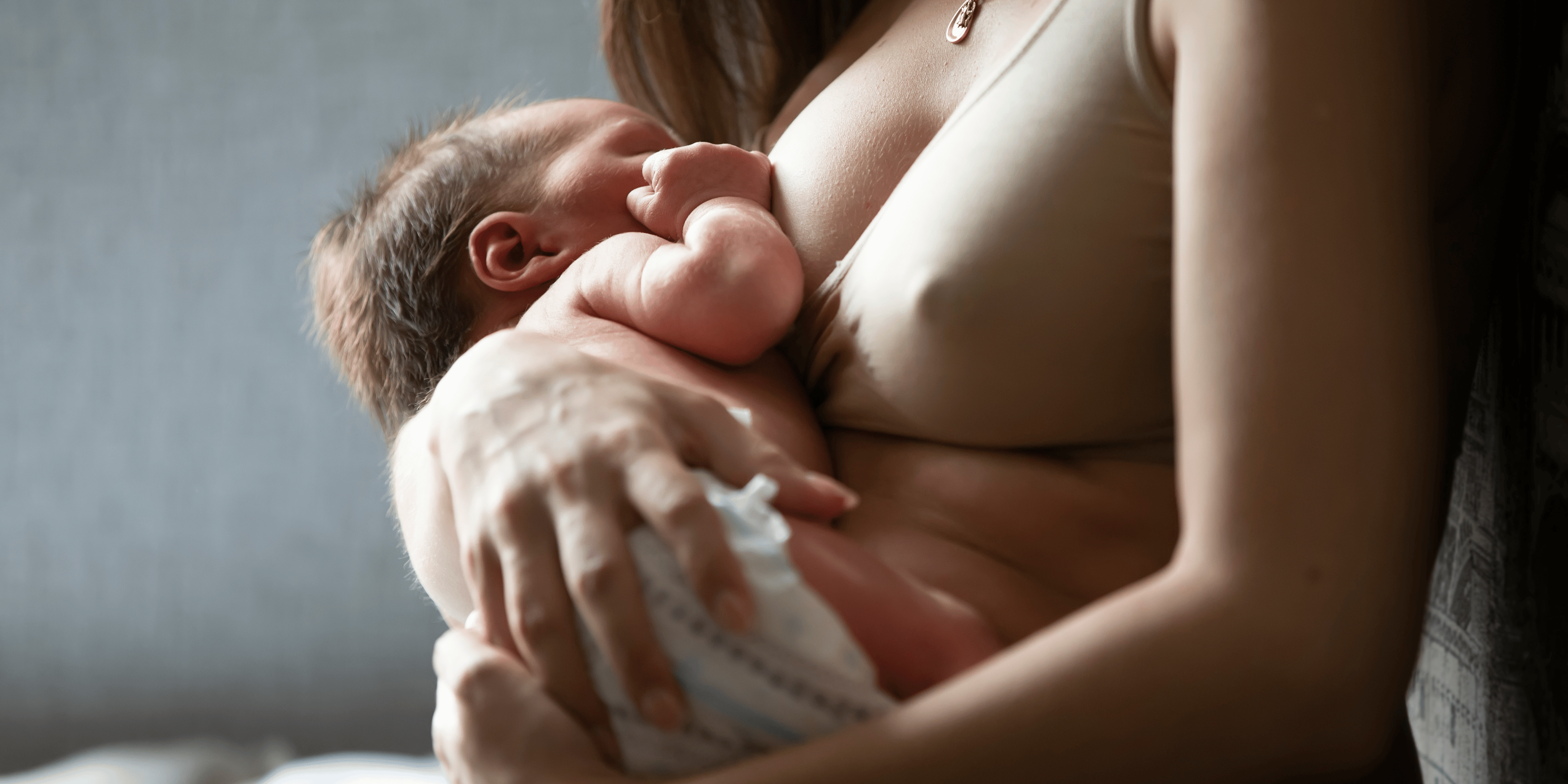 Mother and newborn baby, breastfeeding