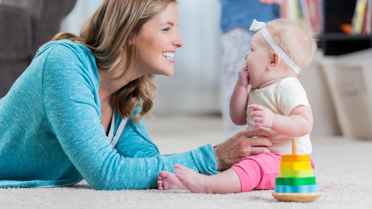 mom and baby smiling 