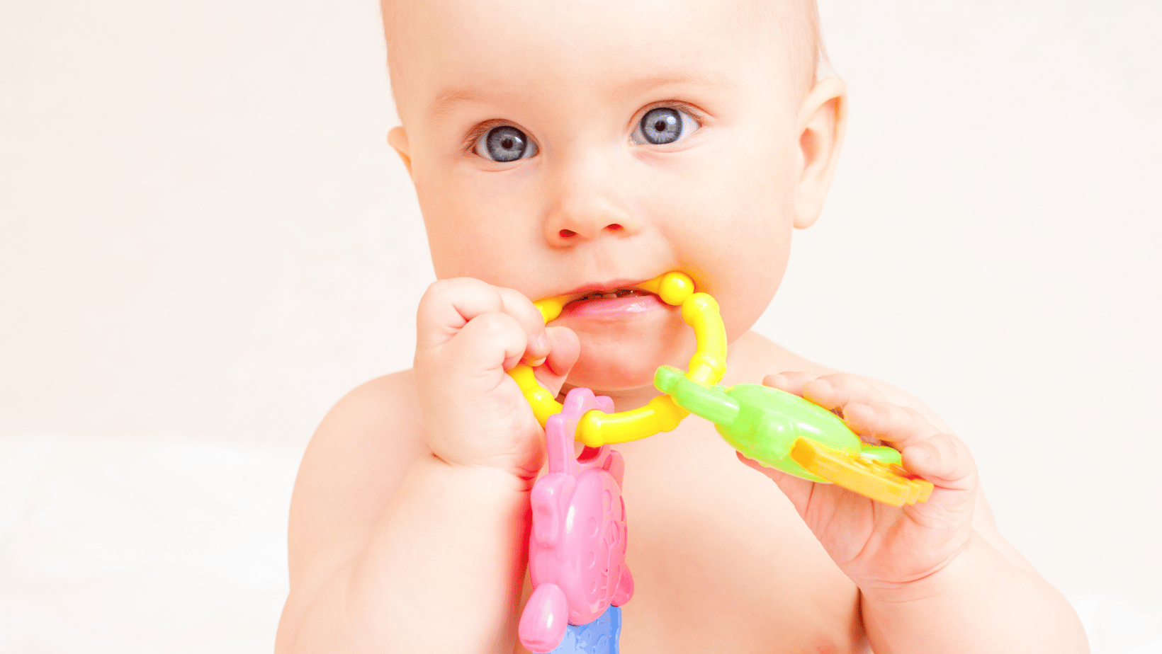 Baby biting a chew toy