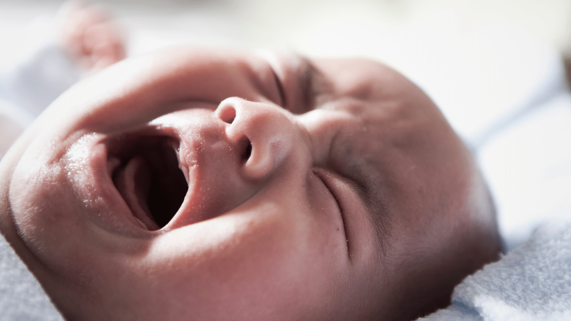 Baby wailing while nursing, infant weeping during breastfeeding, newborn sobbing while nursing, baby bawling during feeding