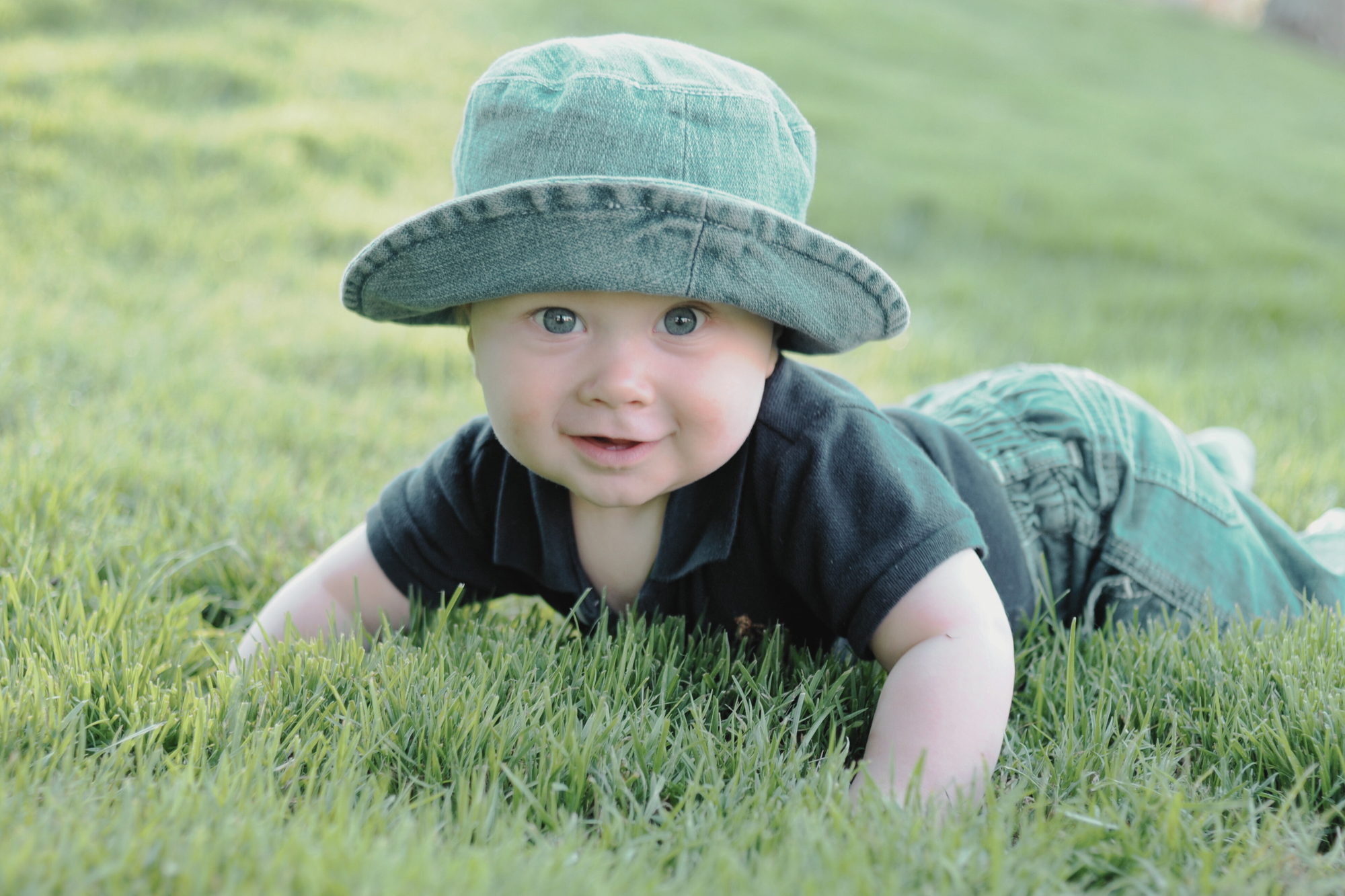 Baby boy playing on the grass