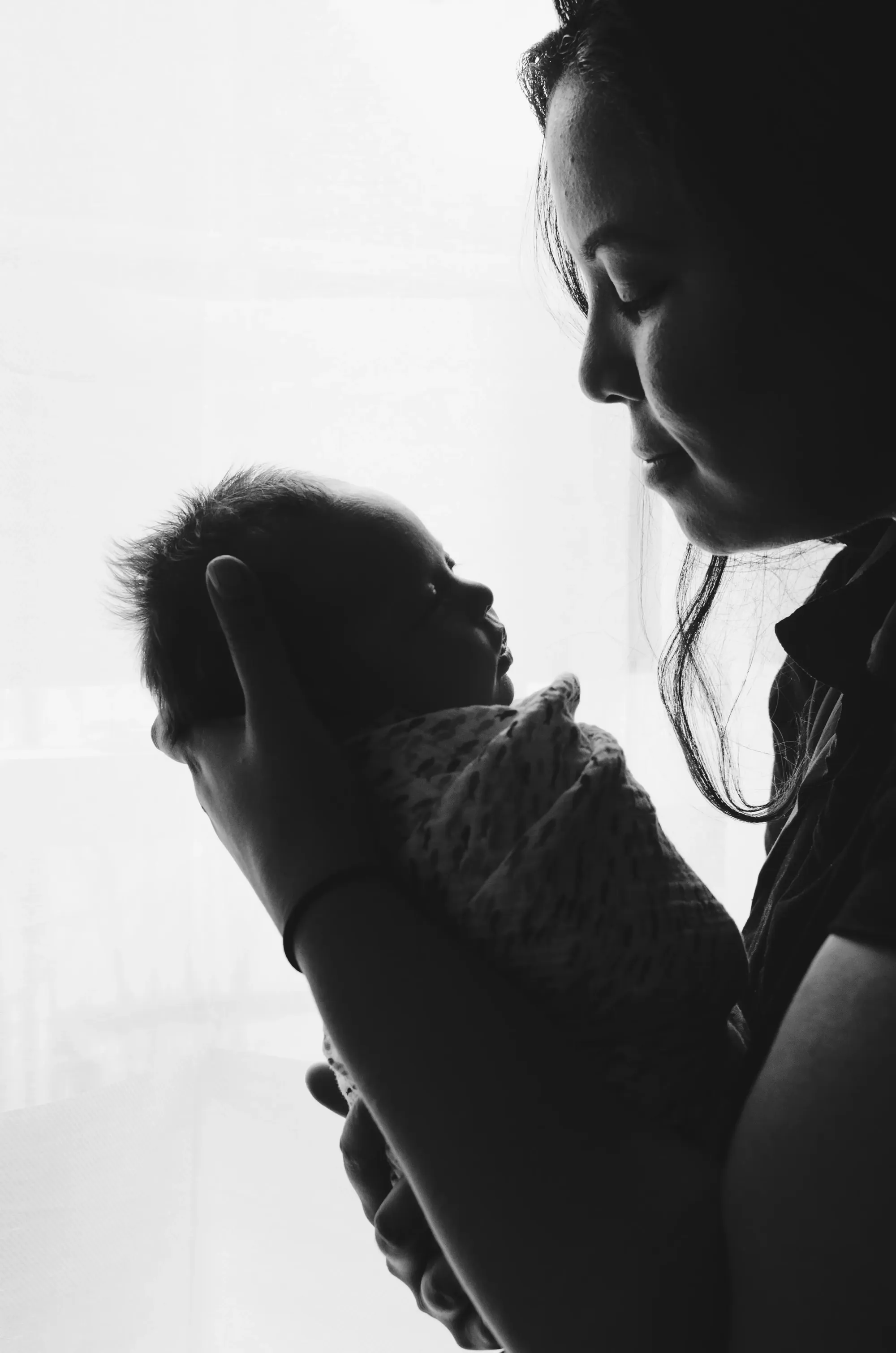 mother holding baby