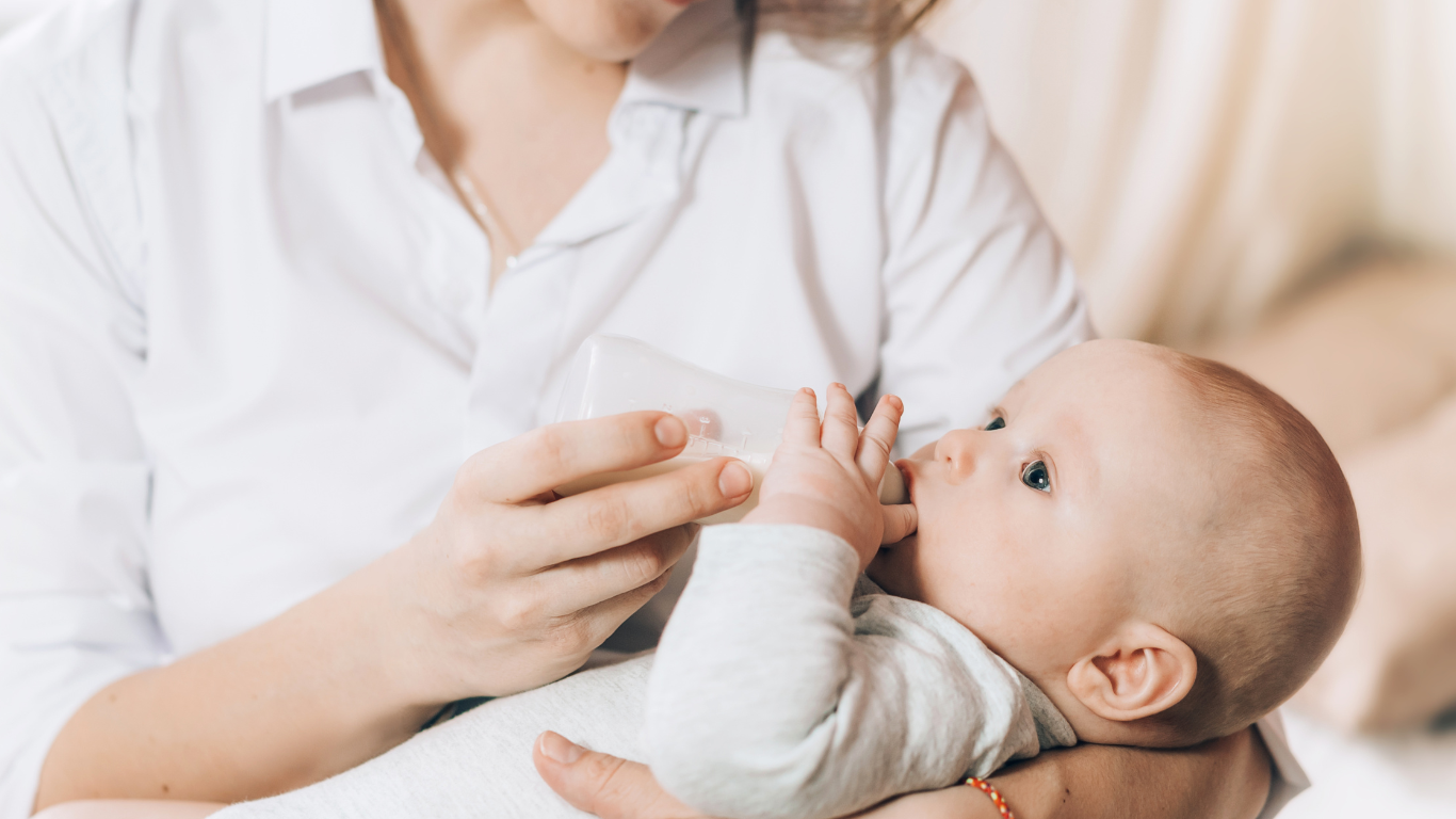 baby drinking from a bottle