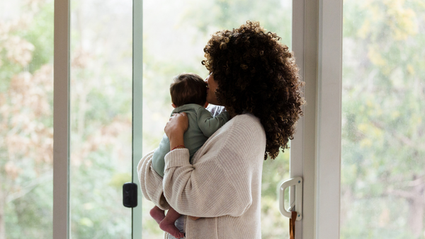 Mom and baby looking outside