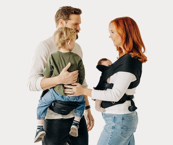Mom and dad wearing Tushbaby