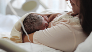 premature baby being breastfed