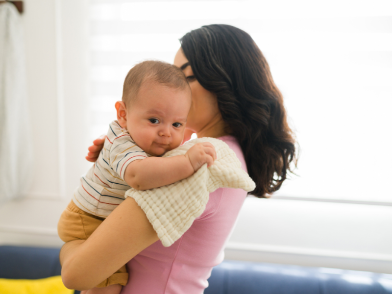 Mother burping her baby, burp baby