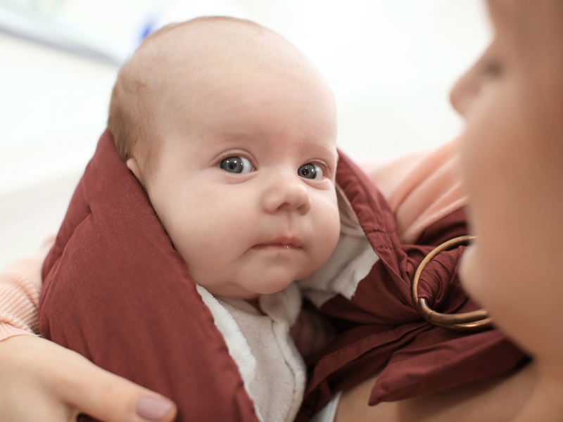 How to Breastfeed in a Nursing Sling: Tips & Babywearing Benefits