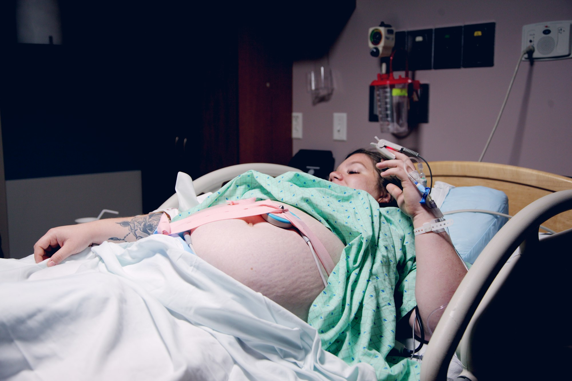 pregnant mom laying in hospital bed